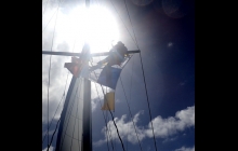 Erik at the mast looking out for corals as we entering the lagoon. 